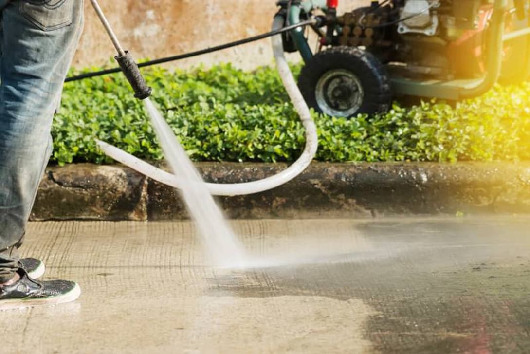 Pressure washing a driveway